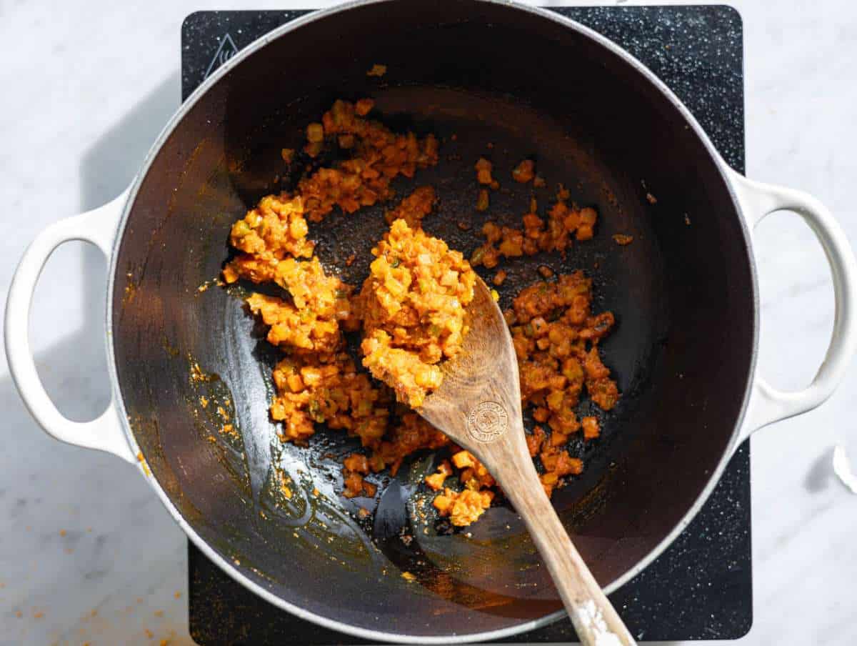 Step 2 Tomato paste garlic and spices stirred into softened vegetables.