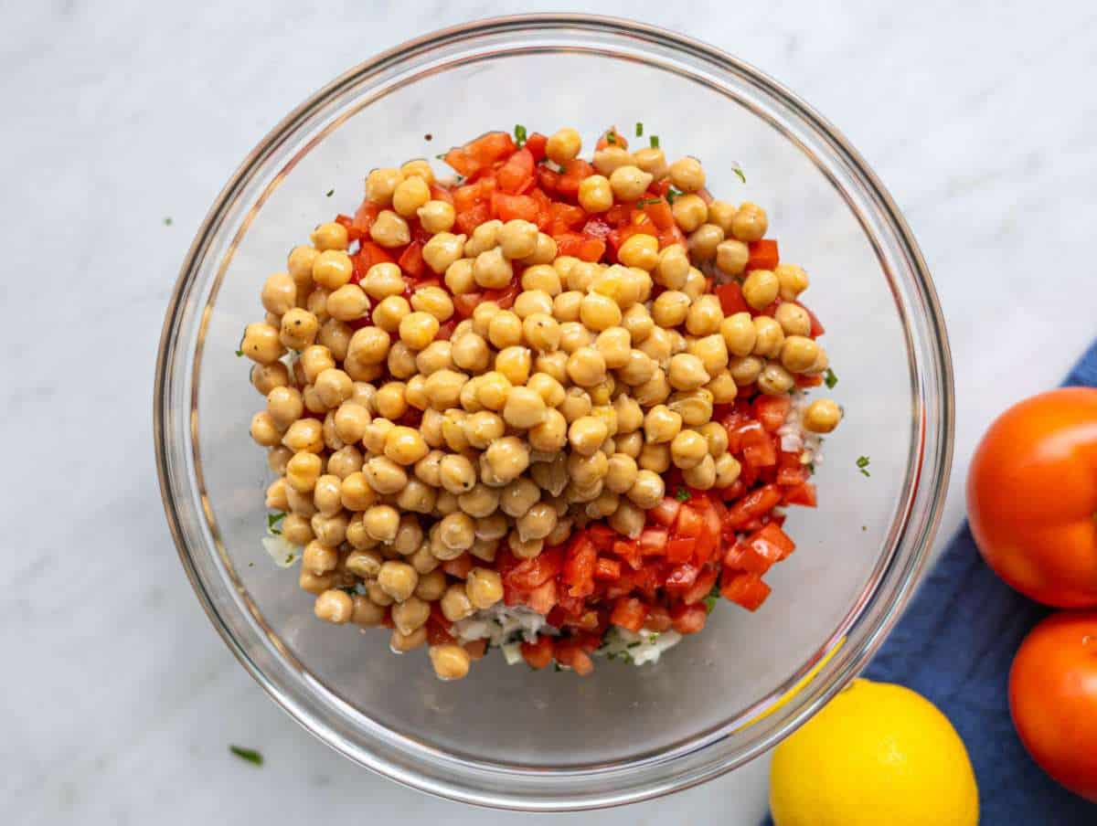 Step 3 Finely chopped parsley, mint, green onions, diced tomatoes and chickpeas in a mixing bowl.
