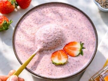 Step 3 Stirring chilled chia pudding before serving with fresh strawberry topping.