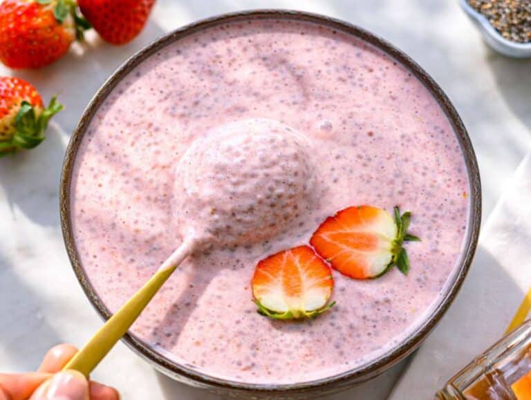 Step 3 Stirring chilled chia pudding before serving with fresh strawberry topping.