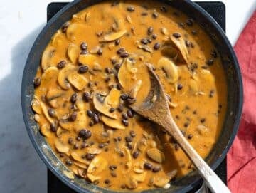 Step 4 Creamy sauce simmering with black beans in skillet.