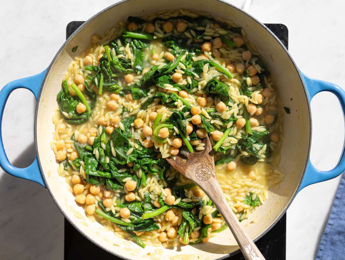 Step 4 Fresh spinach stirred into hot orzo until wilted.