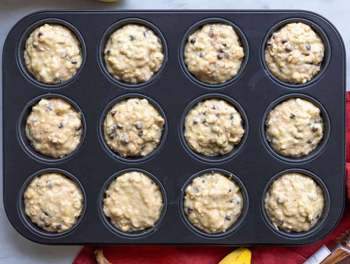 Step 4 Muffin batter evenly divided into lined muffin pan cups.