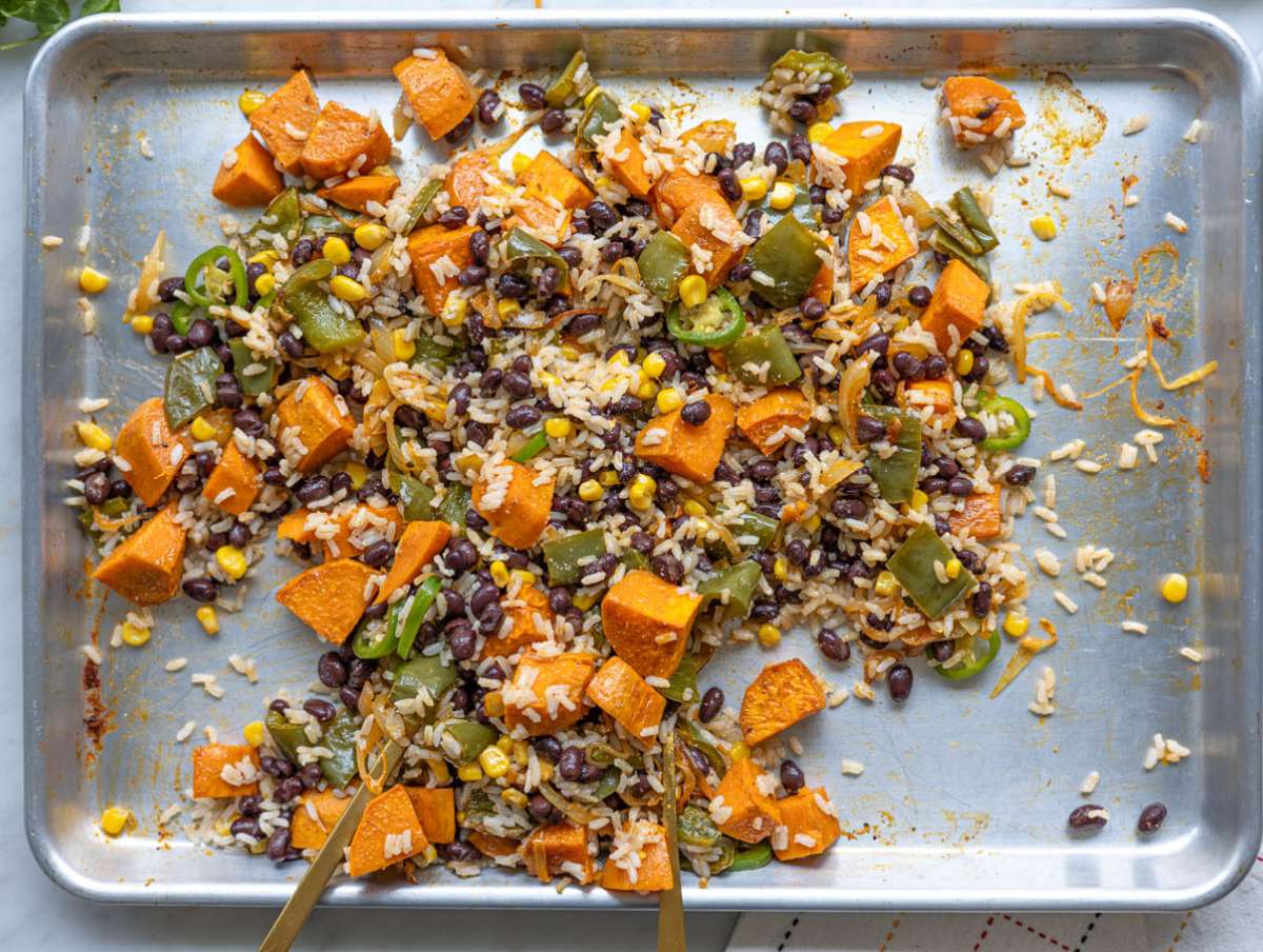 Step 4 Rice, beans, and corn tossed with roasted vegetables on hot tray.