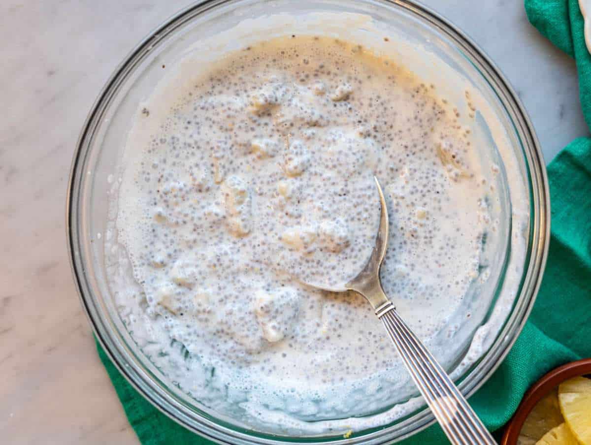 Step 4 Spoon stirring thick pineapple chia pudding before serving.