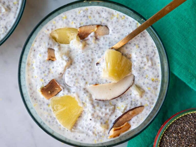 Step 5 Bowl of pineapple chia pudding with tropical toppings and soft morning light.