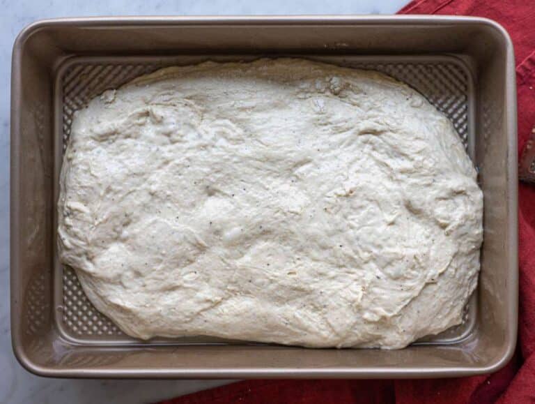 Step 5 Dough spread into an oiled baking pan before second rise