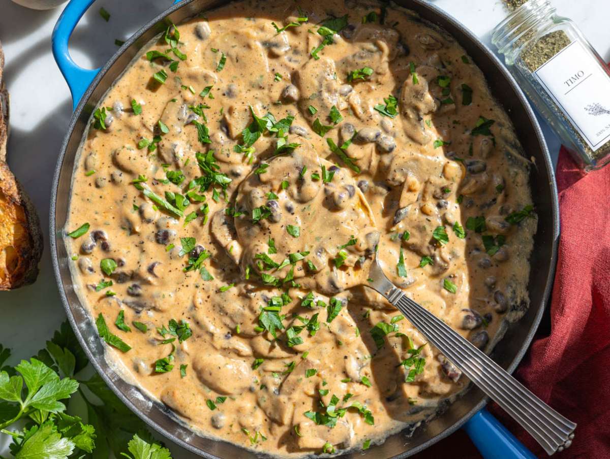 Step 5 Greek yogurt and parsley stirred into mushroom stroganoff off the heat.