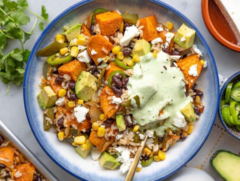 Step 5 Serving black bean and rice bowl with vibrant toppings and drizzle.