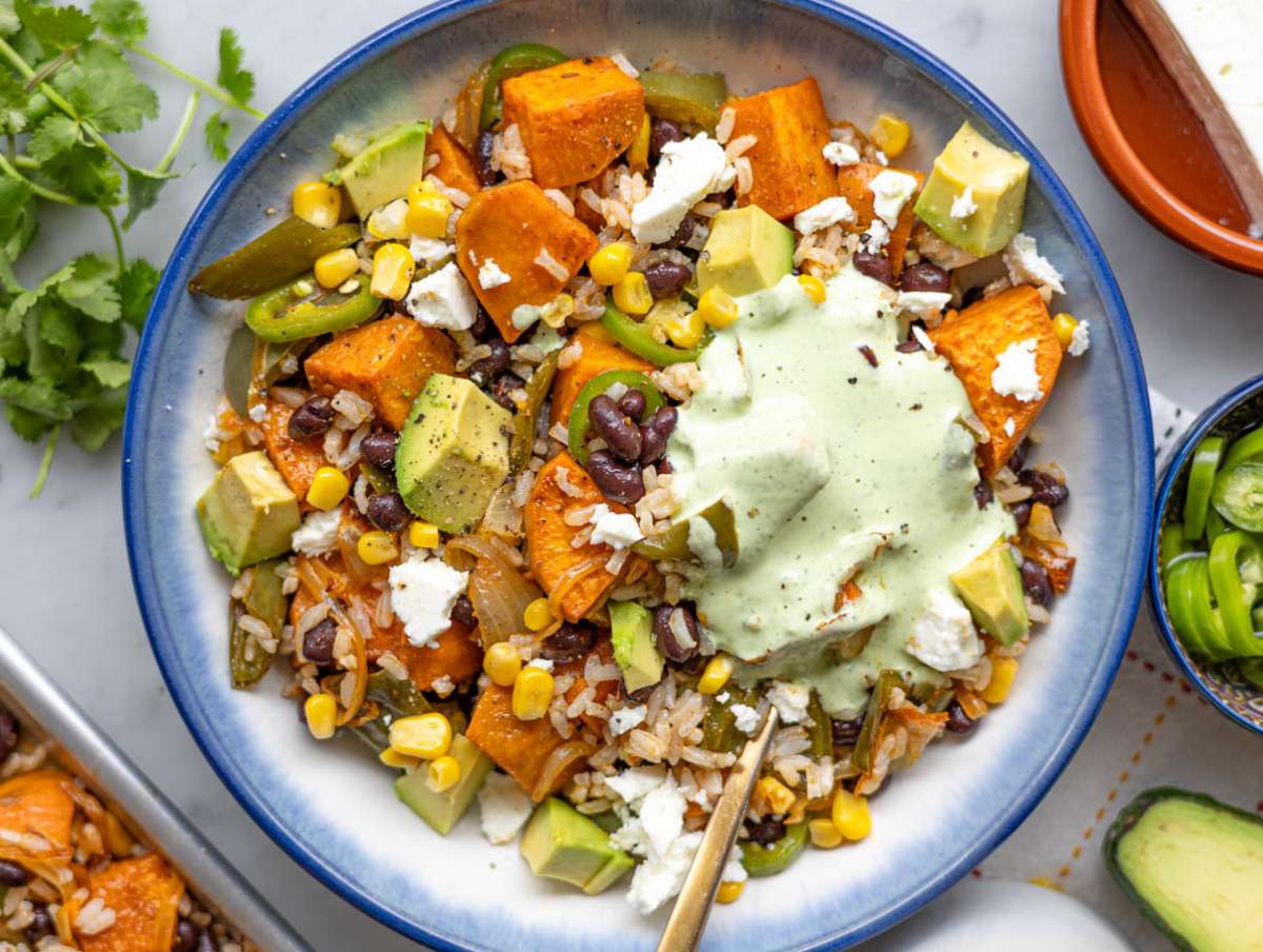 Step 5 Serving black bean and rice bowl with vibrant toppings and drizzle.