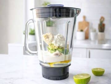 Ingredients in a blender before blending the smoothie.