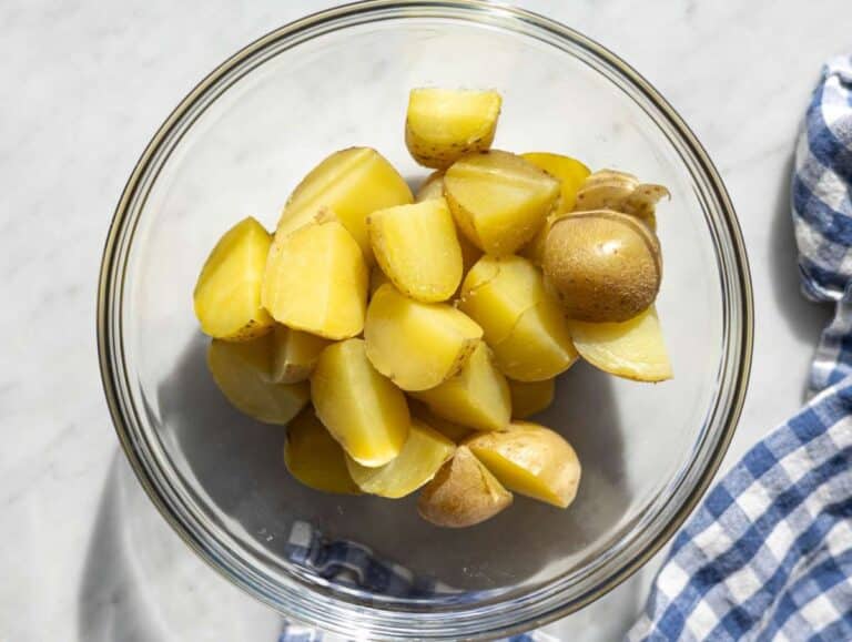 Step 1 Boiled potatoes cooling off in a bowl.