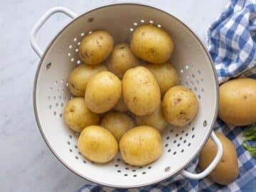Step 1 Boiled potatoes steaming off in a colander.