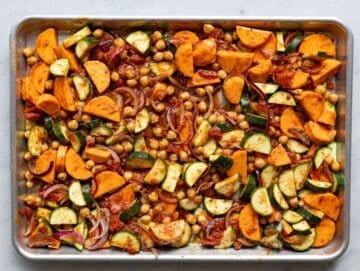 Step 1 Chopped sweet potatoes, zucchini, onion, and chickpeas on sheet pan.