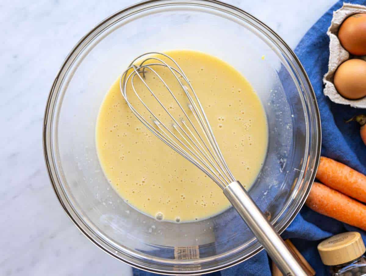 Step 1 Mixing wet ingredients in bowl on marble surface near window light.