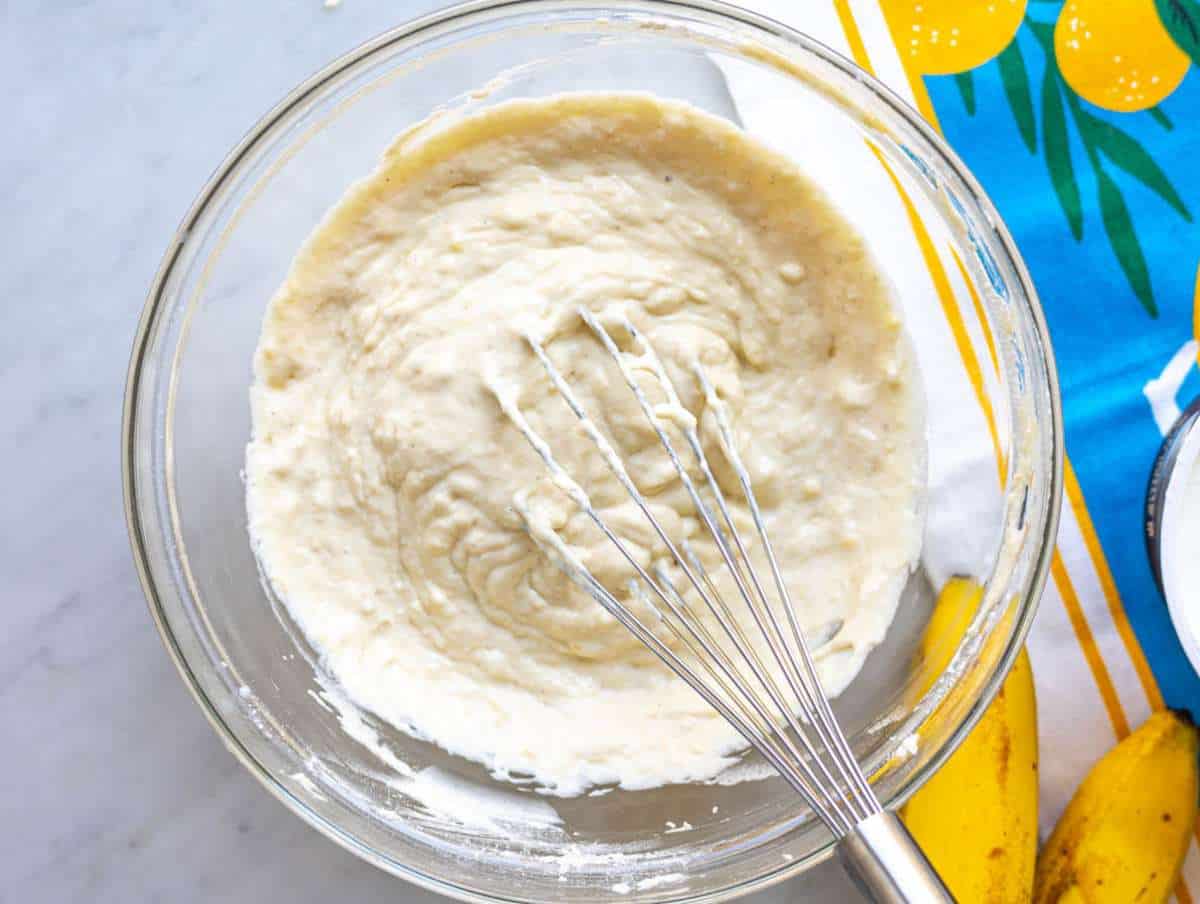 Step 2 Flour and baking powder folded into batter with spatula small lumps still visible.