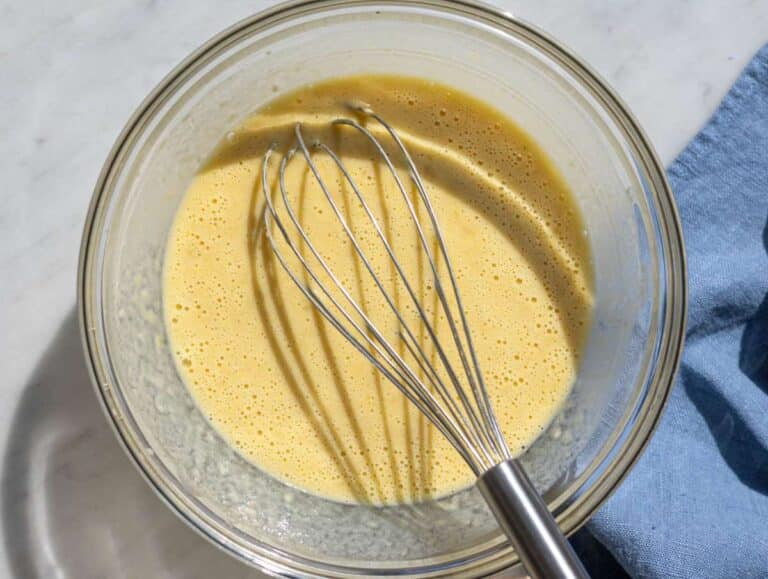 Step 2 Mashing two ripe bananas in a glass bowl with yogurt and honey.