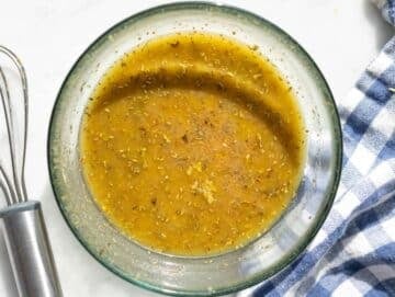 Step 2 Olive oil vinegar mustard oregano and garlic whisked together in a small bowl.