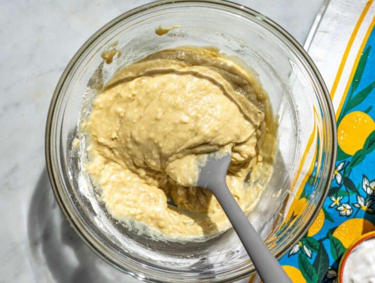 Step 2 Stirring flour into donut batter until just combined with visible thick texture.