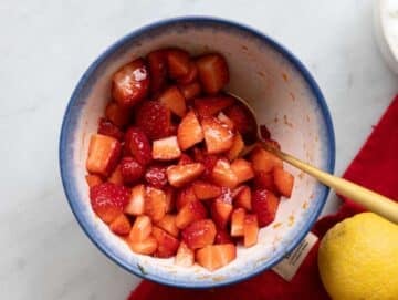 Step 2 Strawberries tossed with sugar and lemon juice releasing bright red juices.