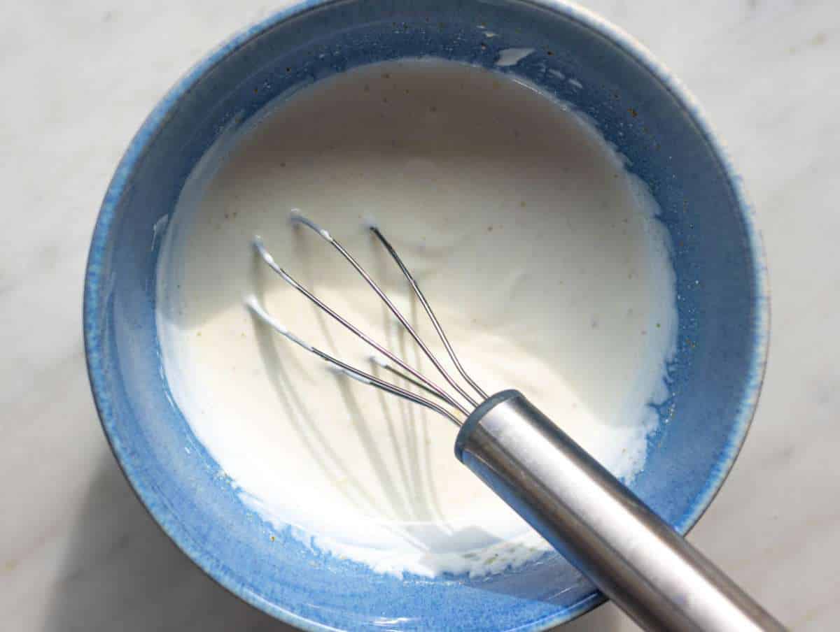 Step 3 Greek yogurt mixed with lemon and cumin in small bowl.