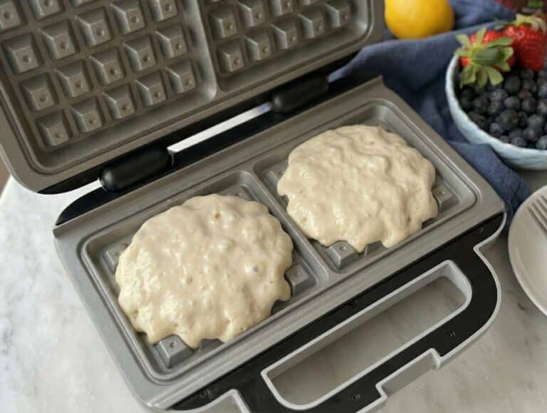 Step 3 Pouring waffle batter into hot waffle iron lightly greased with oil.