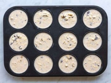 Step 4 Batter spooned into greased muffin pan cups.