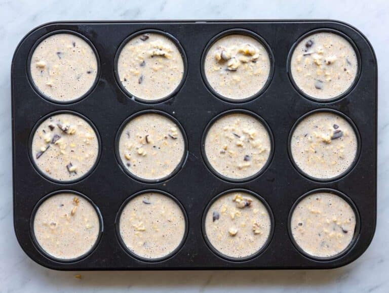 Step 4 Batter spooned into greased muffin pan cups.