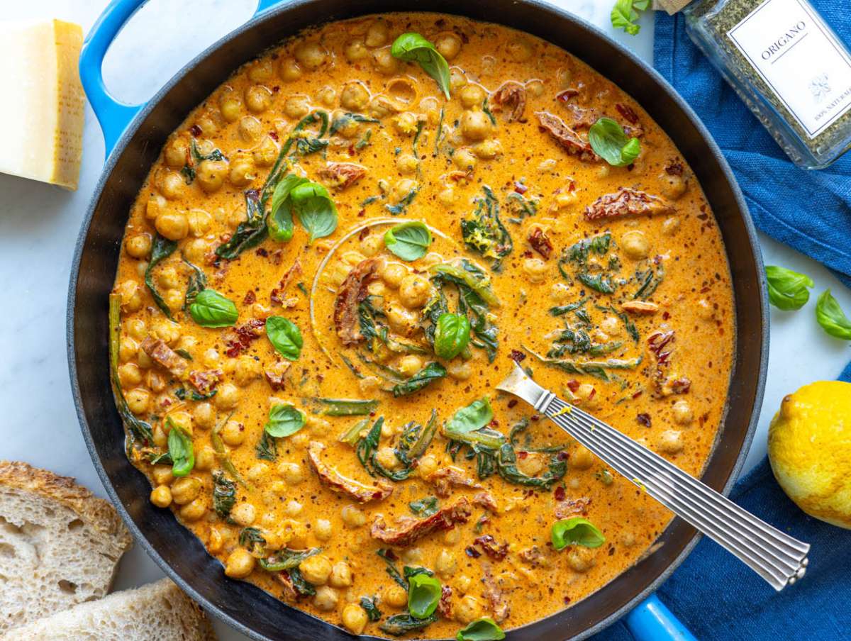 Step 4 Cool Greek yogurt melting into a warm parmesan and tomato chickpea sauce.