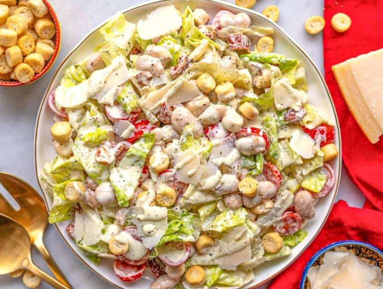 Step 4 Creamy butter bean caesar salad on a platter.