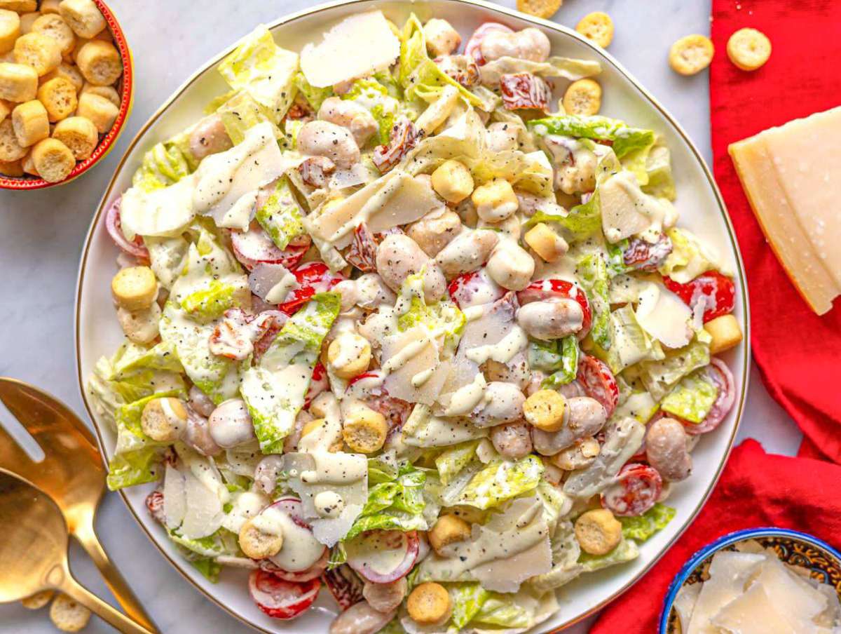 Step 4 Creamy butter bean caesar salad on a platter.