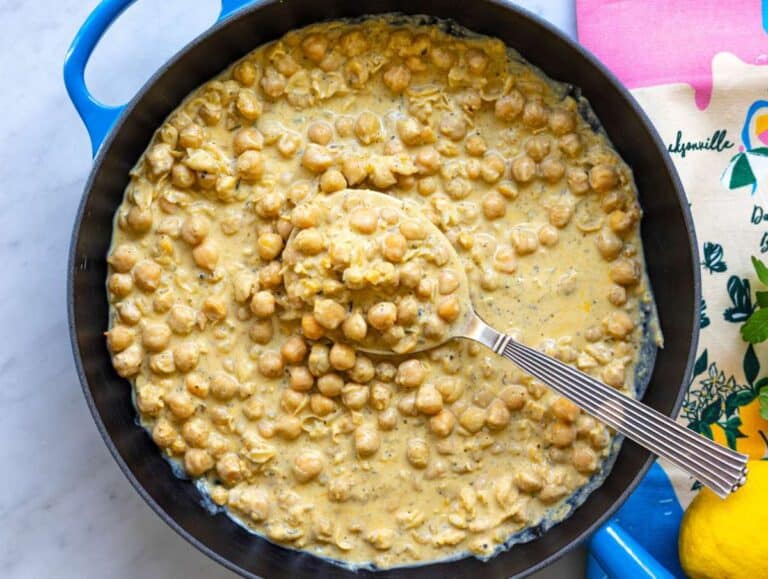 Step 4 Greek yogurt melting into warm chickpeas creating creamy lemon sauce.