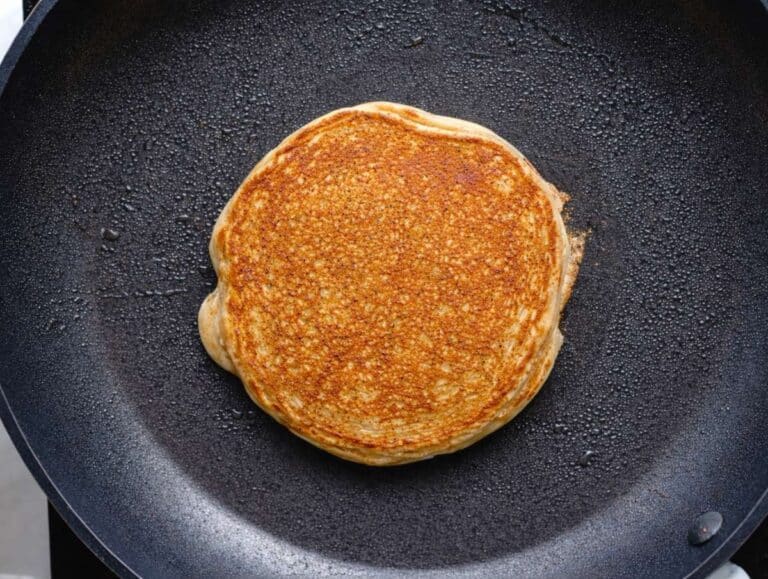 Step 4 Small banana oatmeal pancake cooking in a nonstick skillet until golden.
