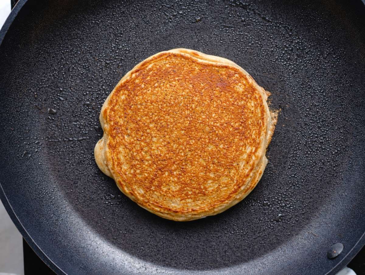 Step 4 Small banana oatmeal pancake cooking in a nonstick skillet until golden.