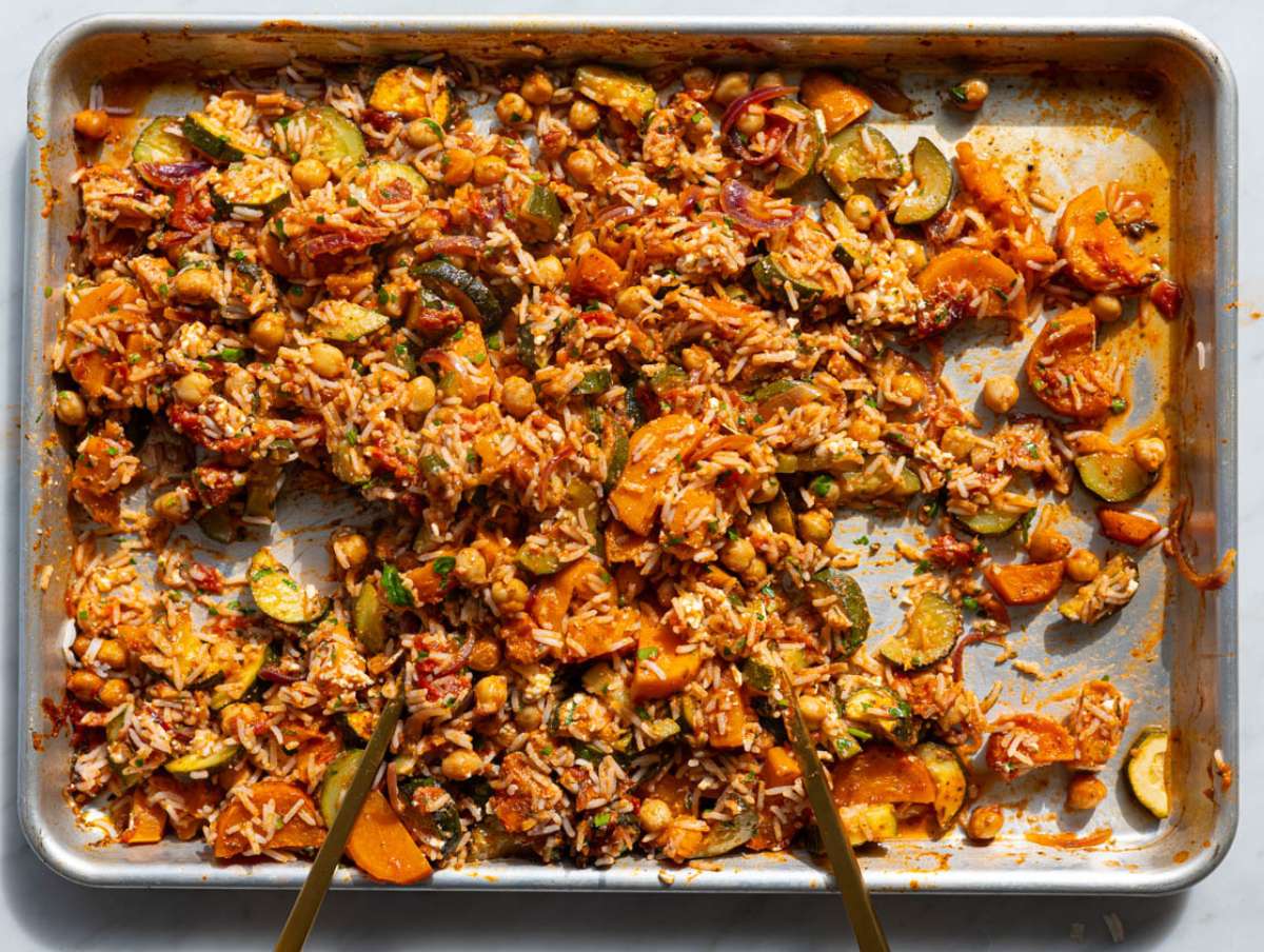 Step 4 Warm rice and feta tossed with roasted vegetables on sheet pan.