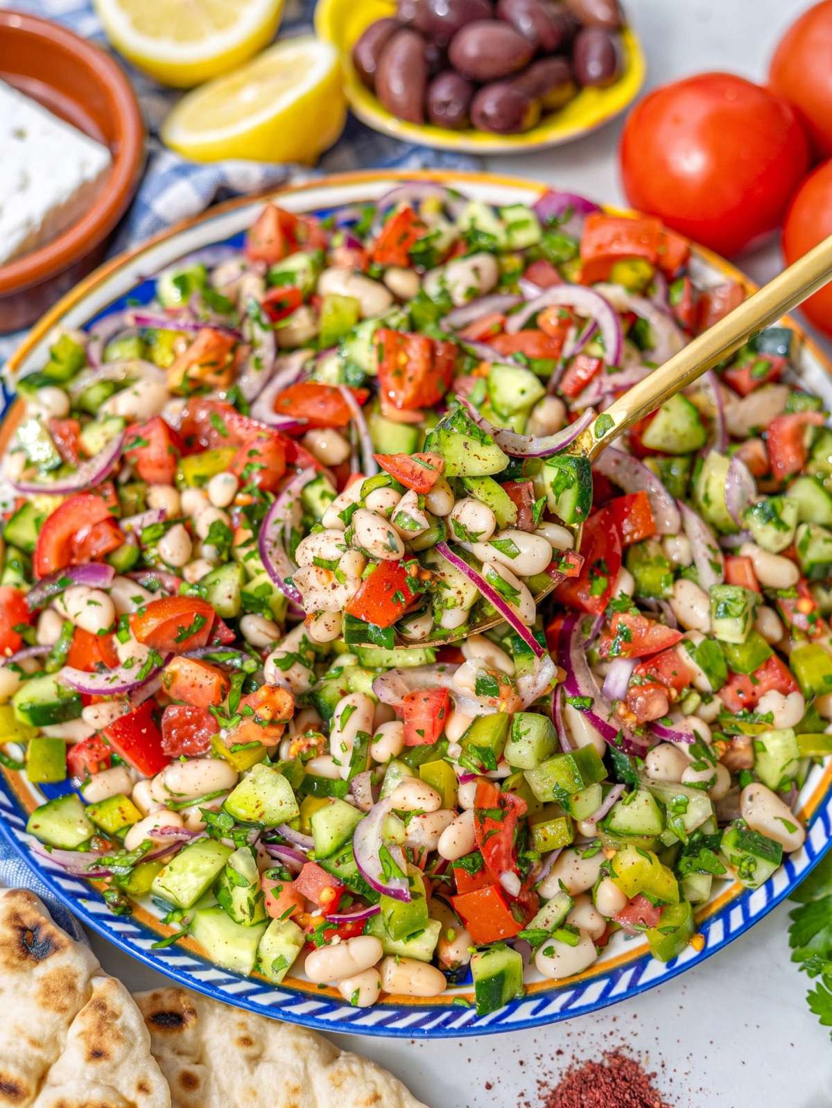 Close up of Turkish shepherdâs salad showing juicy tomatoes and chopped vegetables.