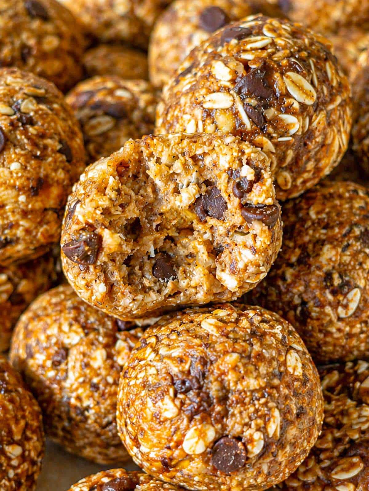 Close-up of banana bread energy ball showing soft, chewy texture and small chocolate pieces.