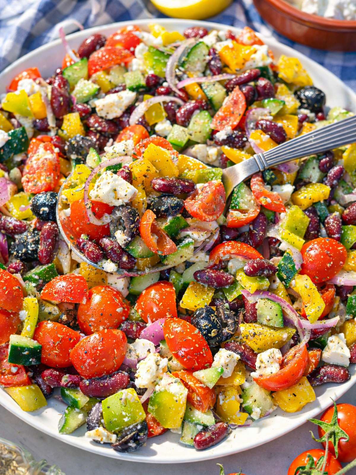 Close up of kidney bean salad with creamy feta and glossy lemon dressing.