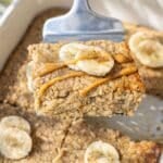 Close up of moist peanut butter banana baked oatmeal showing creamy oat texture and peanut butter swirls.