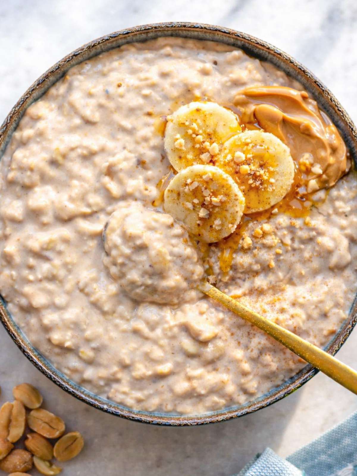Close up of peanut butter banana overnight oats showing thick creamy oats and banana slices.
