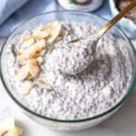 Coconut chia pudding in a breakfast bowl with golden spoon.