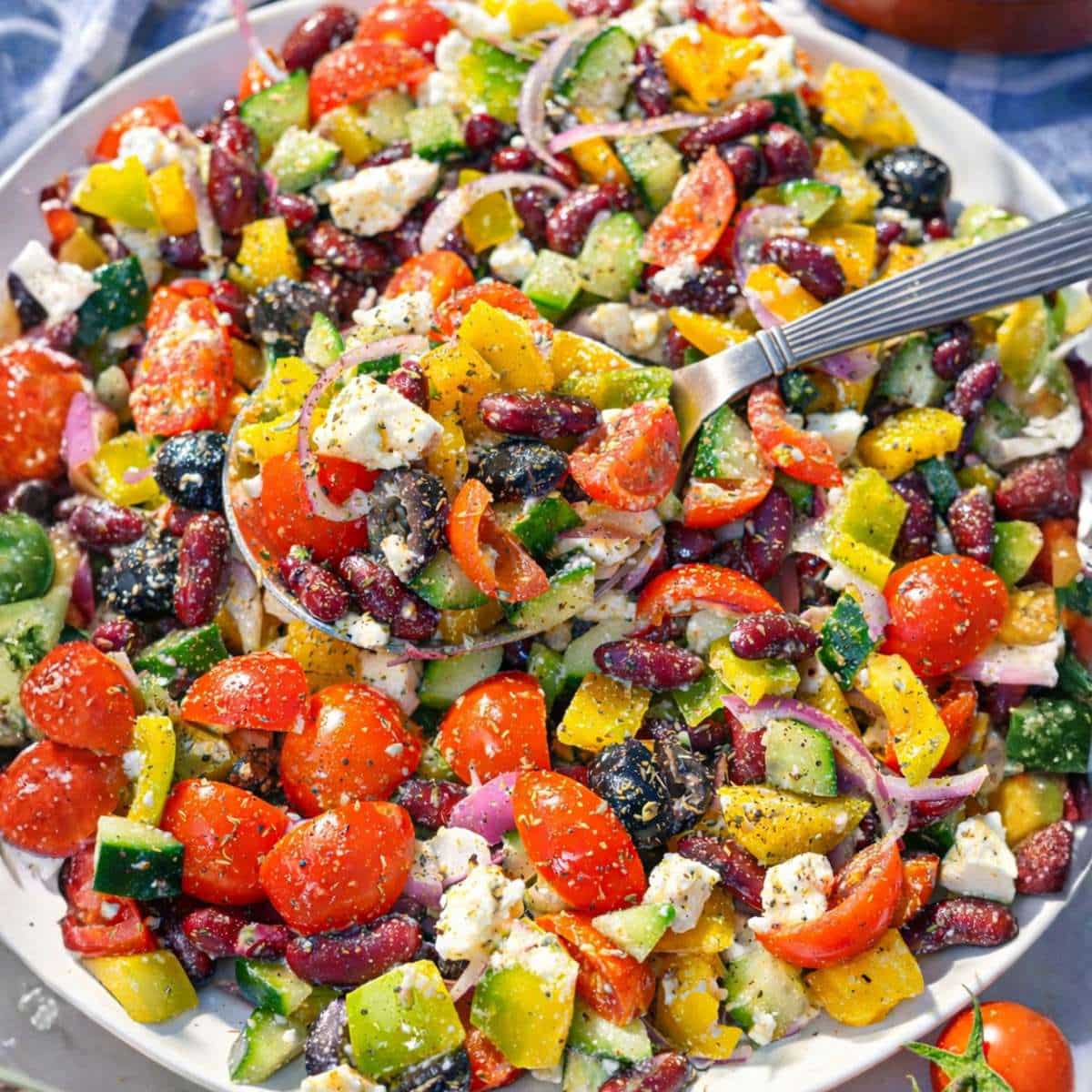 Kidney bean salad served in bowl near window with soft natural light.