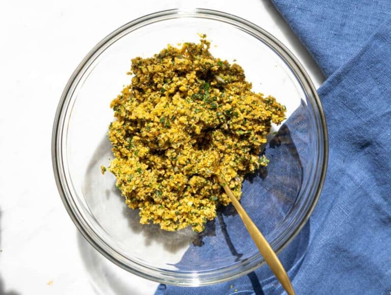 Step 1 Chickpeas, herbs, onion, and garlic pulsed into coarse falafel mixture.