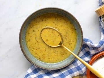 Step 1 Whisking lemon dressing in small bowl on marble surface near window.