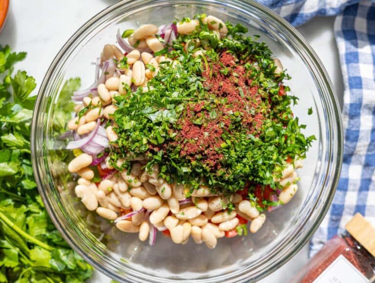 Step 2 Chopped vegetables mixed in a bowl with olive oil and lemon dressing.