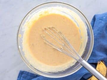 Step 2 Mashed bananas mixed with peanut butter honey egg and yogurt in a bowl.