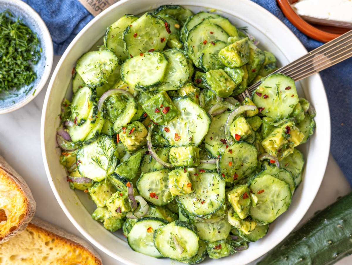Step 2 Mixed cucumber avocado salad showing chunky texture and light dressing coating.