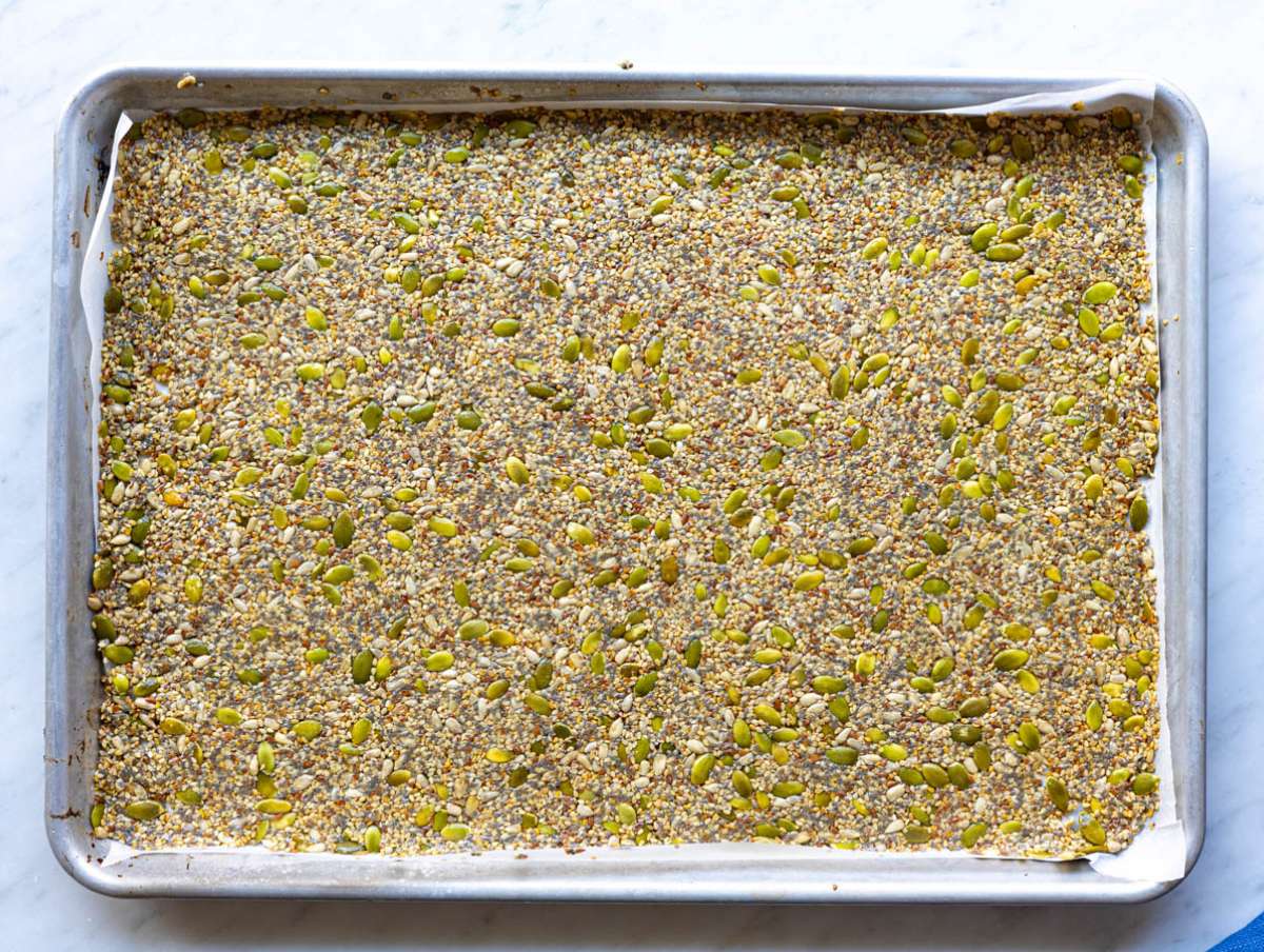Step 2 Seed cracker mixture spread thin and evenly on a parchment-lined baking sheet.