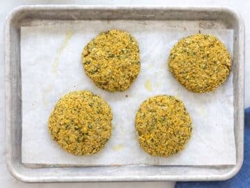 Step 3 Baked falafel patties on lined baking tray.