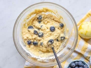Step 3 Batter mixed in a bowl with blueberries folded in.